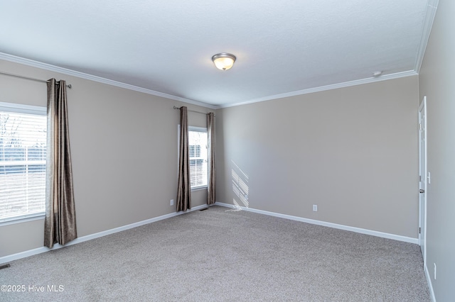 carpeted spare room featuring ornamental molding