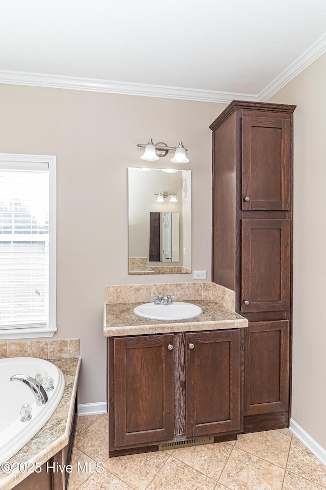 bathroom featuring tile patterned flooring, vanity, a tub to relax in, and ornamental molding