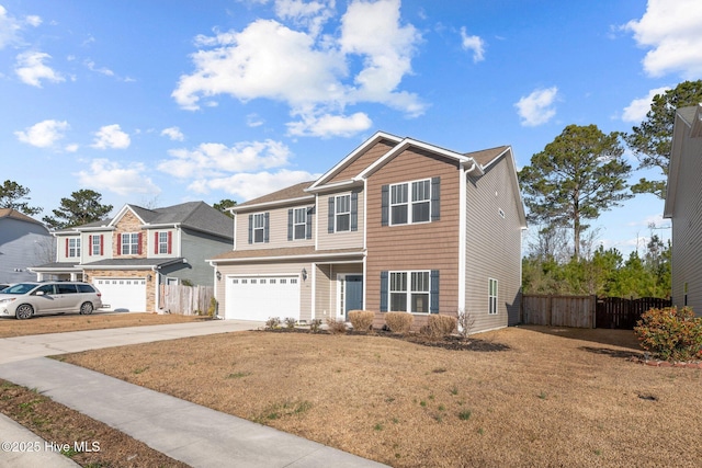 view of front of home featuring a garage and a front lawn