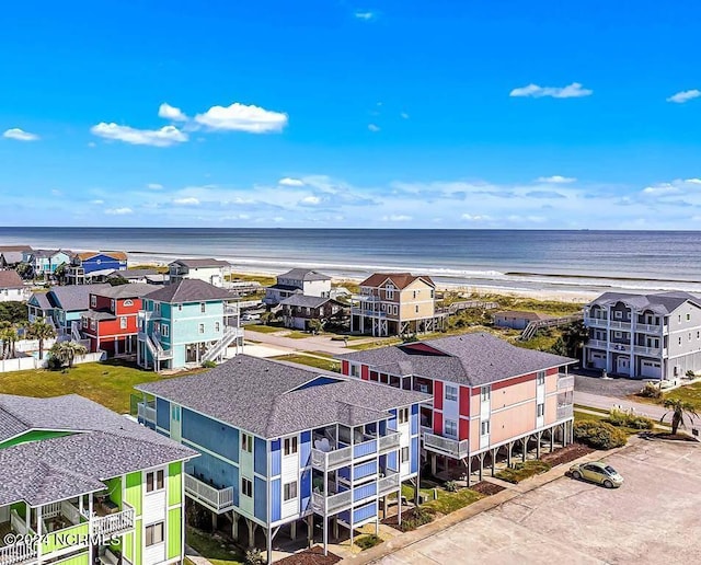 aerial view with a view of the beach and a water view