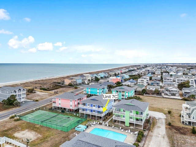 aerial view with a water view and a view of the beach