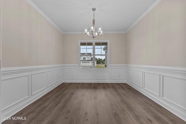 unfurnished dining area with crown molding, wood-type flooring, and a chandelier