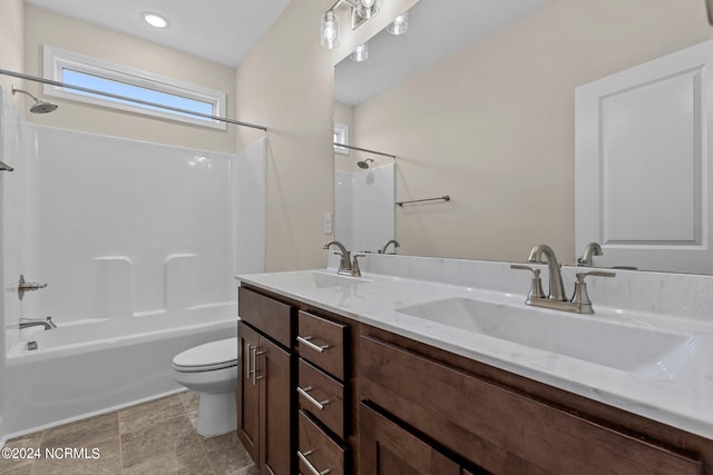 full bathroom with vanity, toilet, and washtub / shower combination