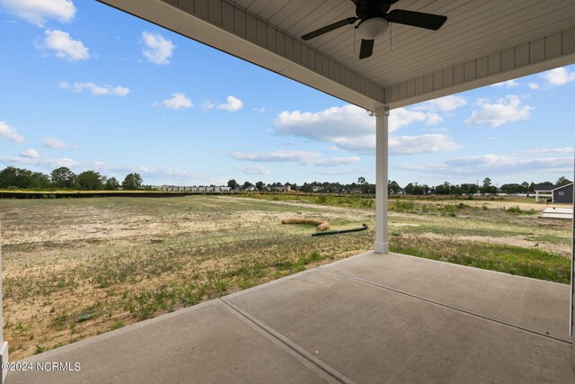 view of patio / terrace with a rural view and ceiling fan