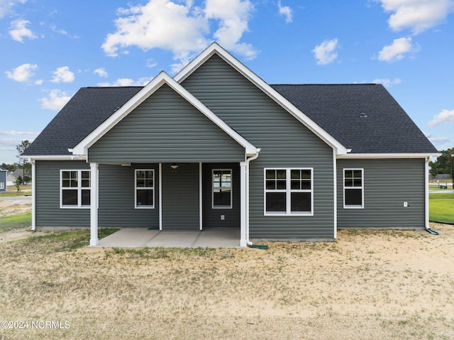 back of property featuring a patio area