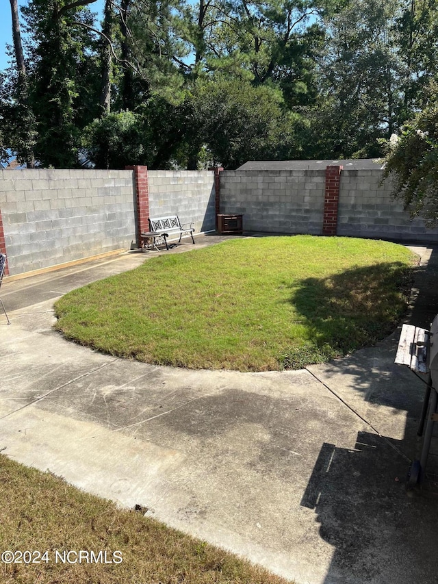 view of yard with a fenced backyard