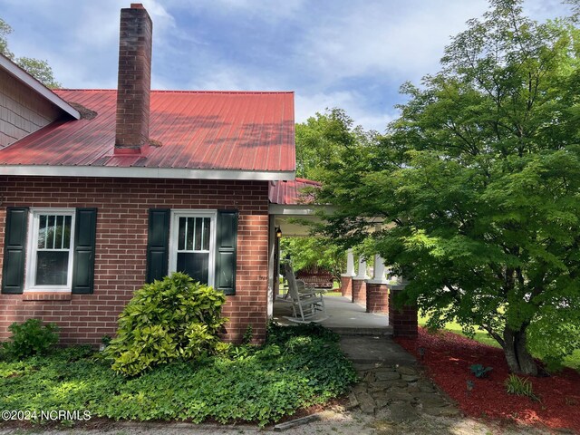 view of side of home featuring a patio