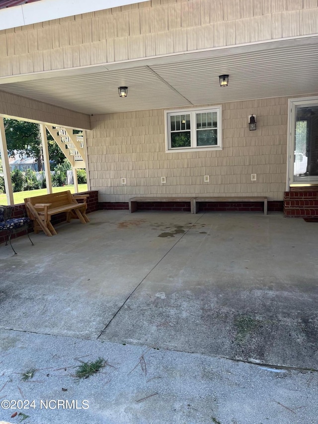 view of patio / terrace featuring stairs