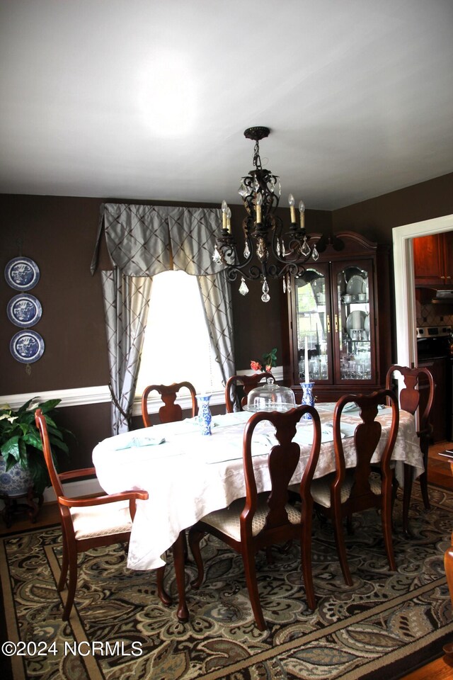 dining space featuring a chandelier