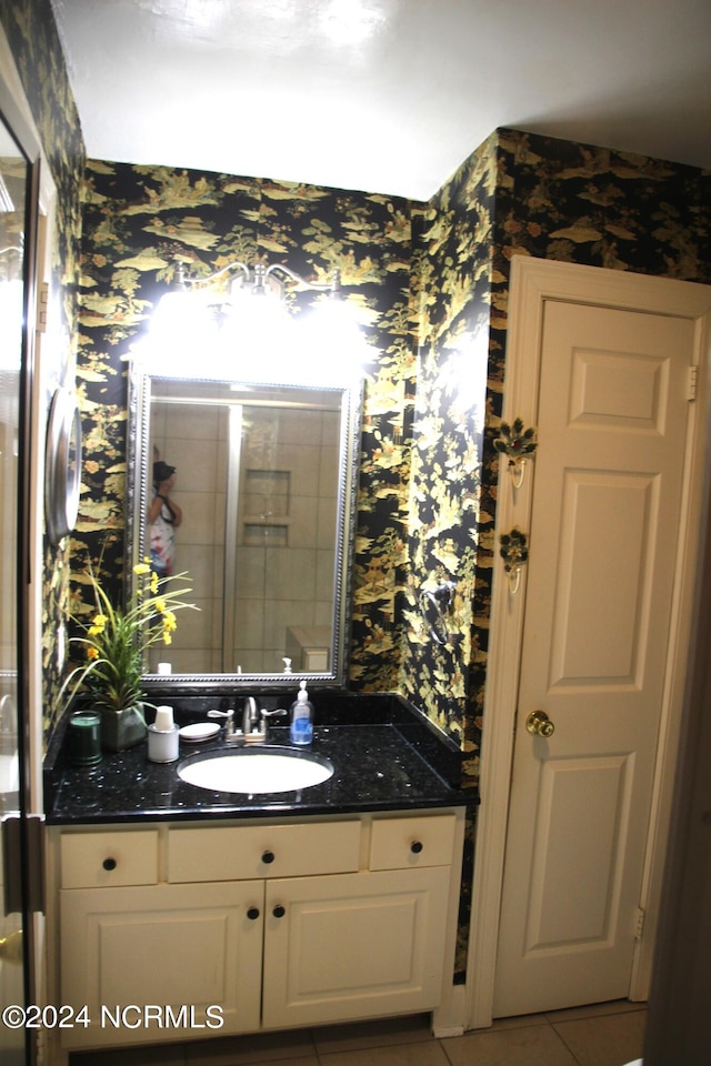 bathroom featuring vanity and tile flooring