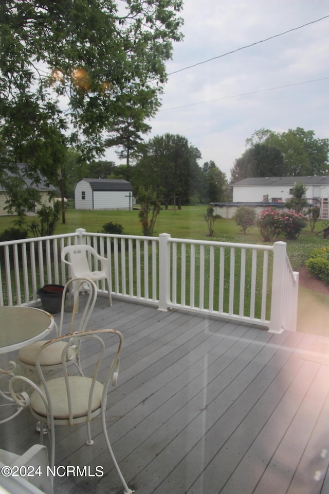 wooden deck featuring an outdoor structure