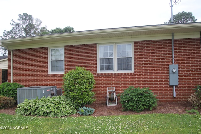 view of property exterior with central AC unit