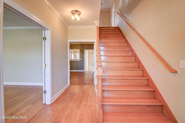 135 Vashti Dr, Morehead City, NC 28557 - stairs with baseboards, crown molding, and wood finished floors