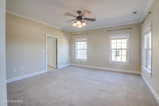 empty room with ornamental molding, light carpet, and visible vents