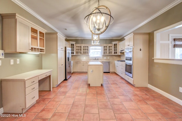 135 Vashti Dr, Morehead City, NC 28557 - kitchen featuring built in study area, stainless steel appliances, light countertops, a notable chandelier, and a kitchen island