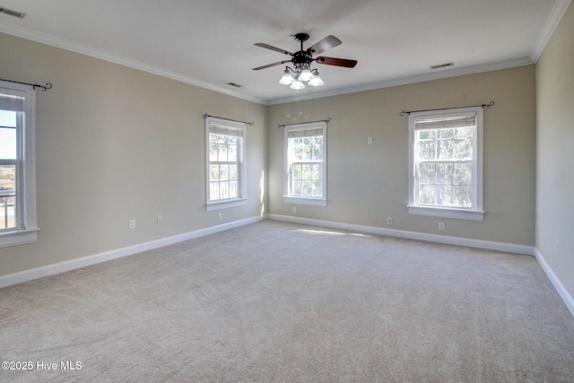 135 Vashti Dr, Morehead City, NC 28557 - spare room with baseboards, visible vents, ornamental molding, and carpet flooring