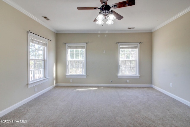 135 Vashti Dr, Morehead City, NC 28557 - carpeted spare room featuring a ceiling fan, crown molding, and visible vents