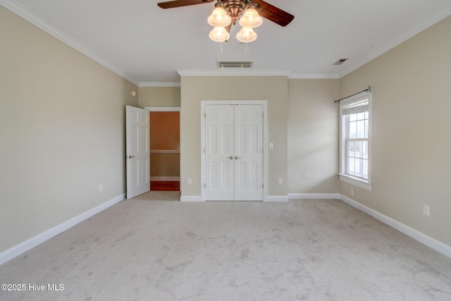 unfurnished bedroom with baseboards, visible vents, and ornamental molding