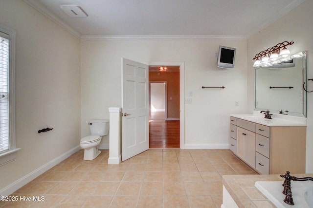 bathroom featuring ornamental molding, a tub to relax in, tile patterned flooring, and toilet