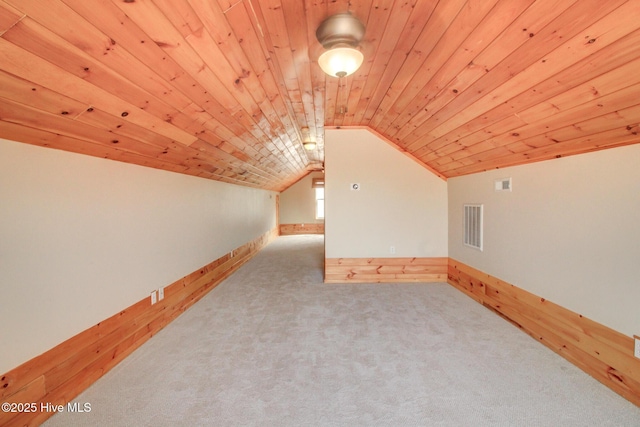 135 Vashti Dr, Morehead City, NC 28557 - additional living space with wood ceiling, vaulted ceiling, carpet flooring, and visible vents