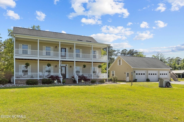 view of front facade featuring a porch, a garage, and a front lawn