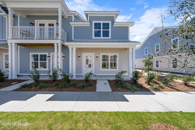 view of front of property with a balcony