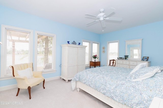 bedroom featuring a ceiling fan, carpet flooring, and baseboards