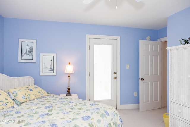 bedroom featuring baseboards, a ceiling fan, and light colored carpet