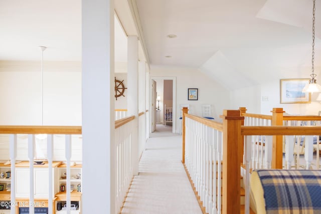 corridor featuring light carpet and an upstairs landing