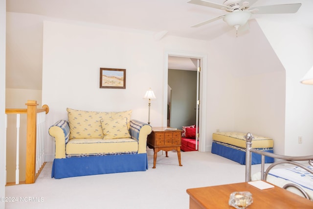 living area with ceiling fan and carpet flooring