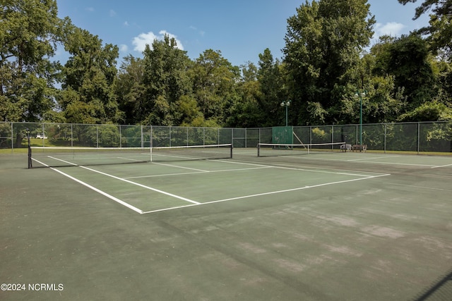 view of sport court with fence