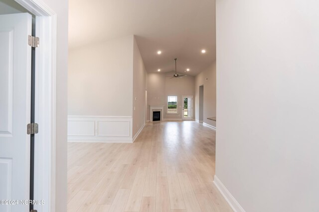 corridor with light hardwood / wood-style flooring