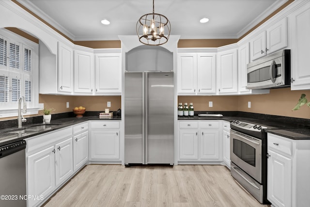 kitchen featuring white cabinetry and appliances with stainless steel finishes