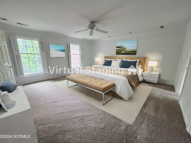 bedroom featuring multiple windows, crown molding, and ceiling fan