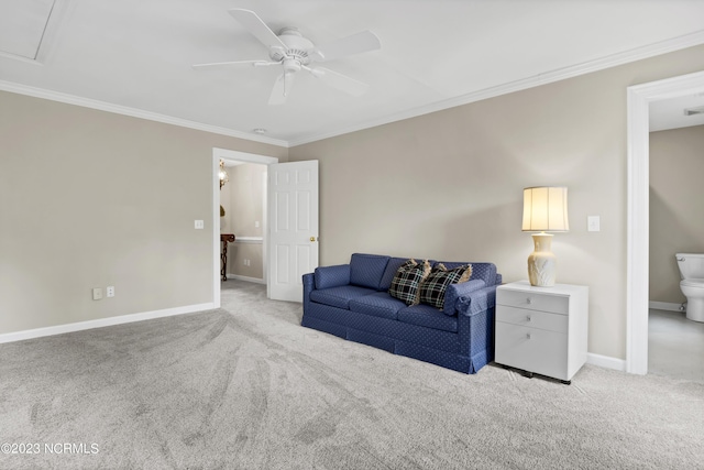 living room featuring ceiling fan, ornamental molding, and light carpet