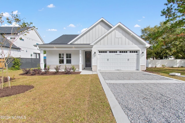 view of front facade with a garage and a front lawn