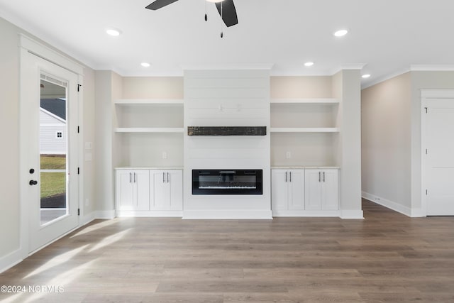 unfurnished living room featuring ornamental molding, light hardwood / wood-style flooring, built in features, and ceiling fan