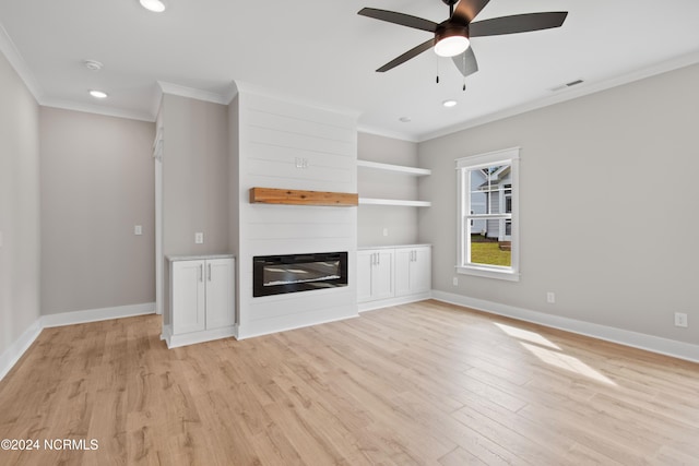 unfurnished living room with a fireplace, ornamental molding, light wood-type flooring, and ceiling fan