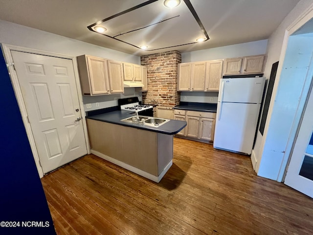 kitchen with white appliances, sink, kitchen peninsula, dark hardwood / wood-style floors, and light brown cabinetry