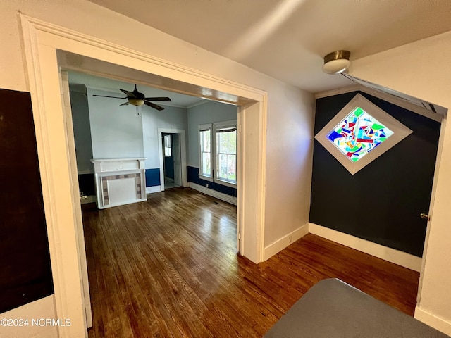 interior space with dark hardwood / wood-style floors and ceiling fan