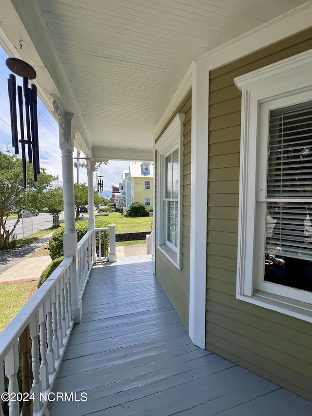 wooden terrace featuring a porch