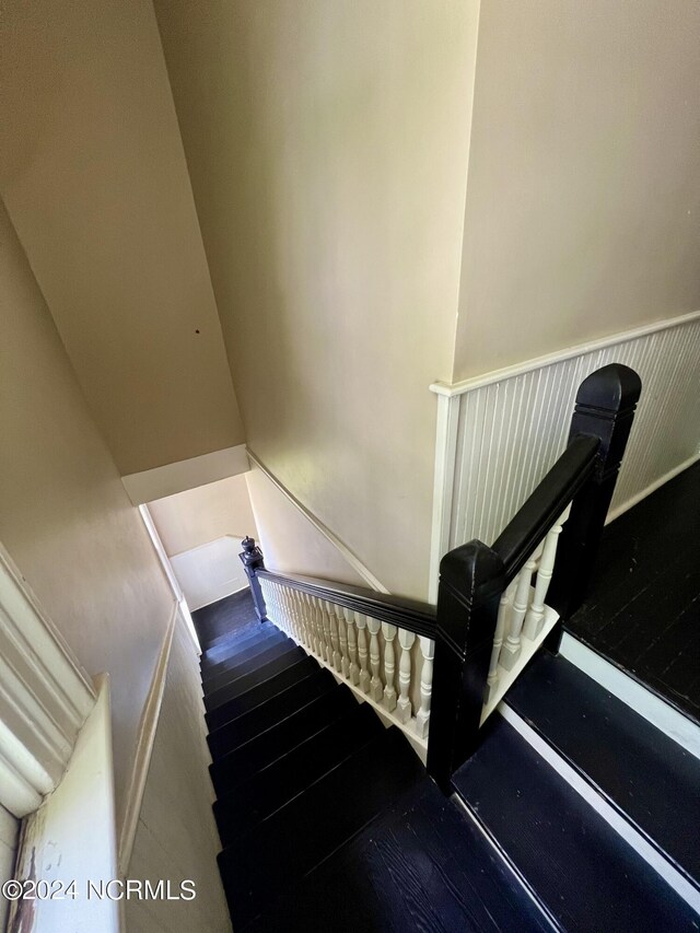 stairway with wood-type flooring