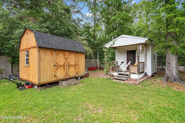 view of outbuilding featuring a yard