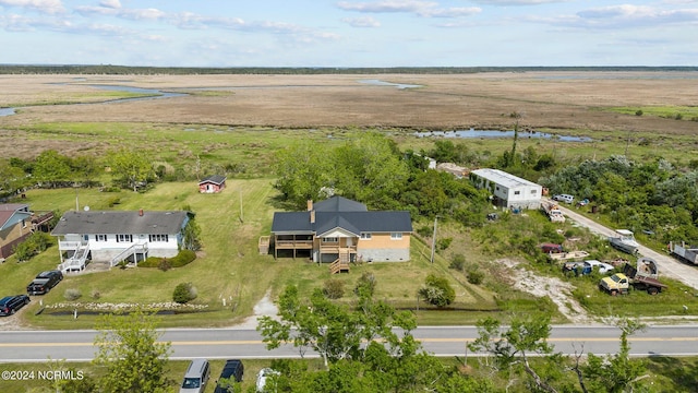 birds eye view of property with a rural view