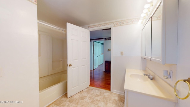 bathroom with tile floors, washtub / shower combination, and large vanity