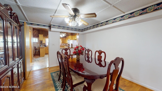 dining area featuring ceiling fan and light tile floors