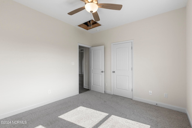 unfurnished bedroom featuring carpet and ceiling fan