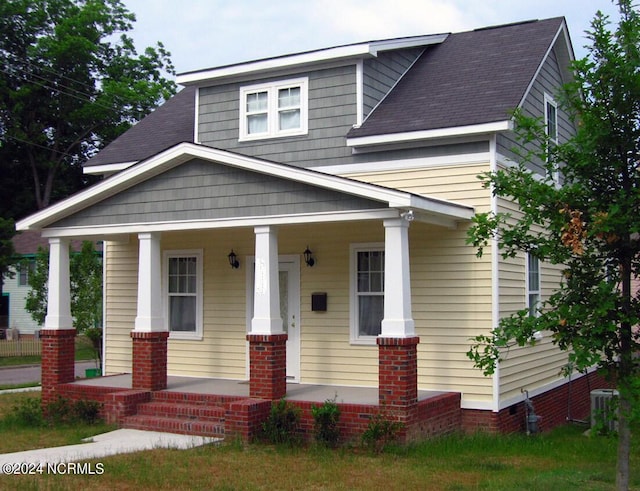 view of front of house featuring central AC unit and covered porch