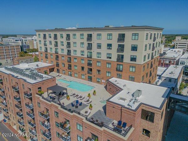 view of property featuring a community pool