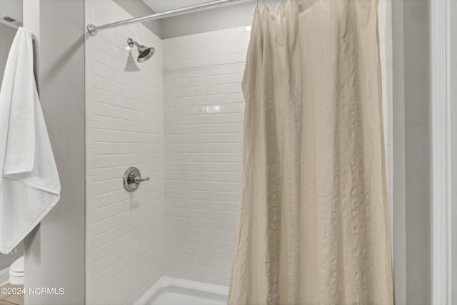 bathroom featuring a shower with curtain